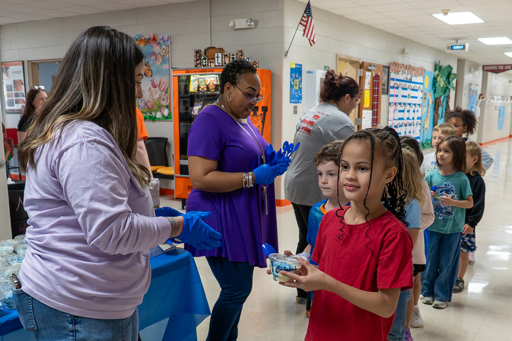 Volunteers handing out custard