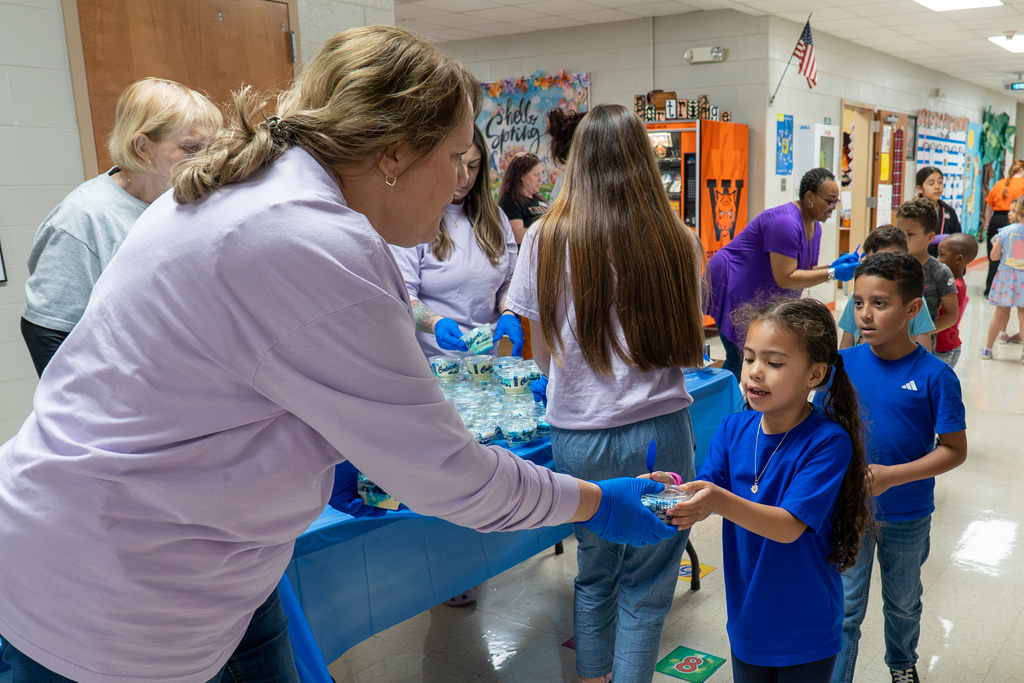 Volunteers handing out custard