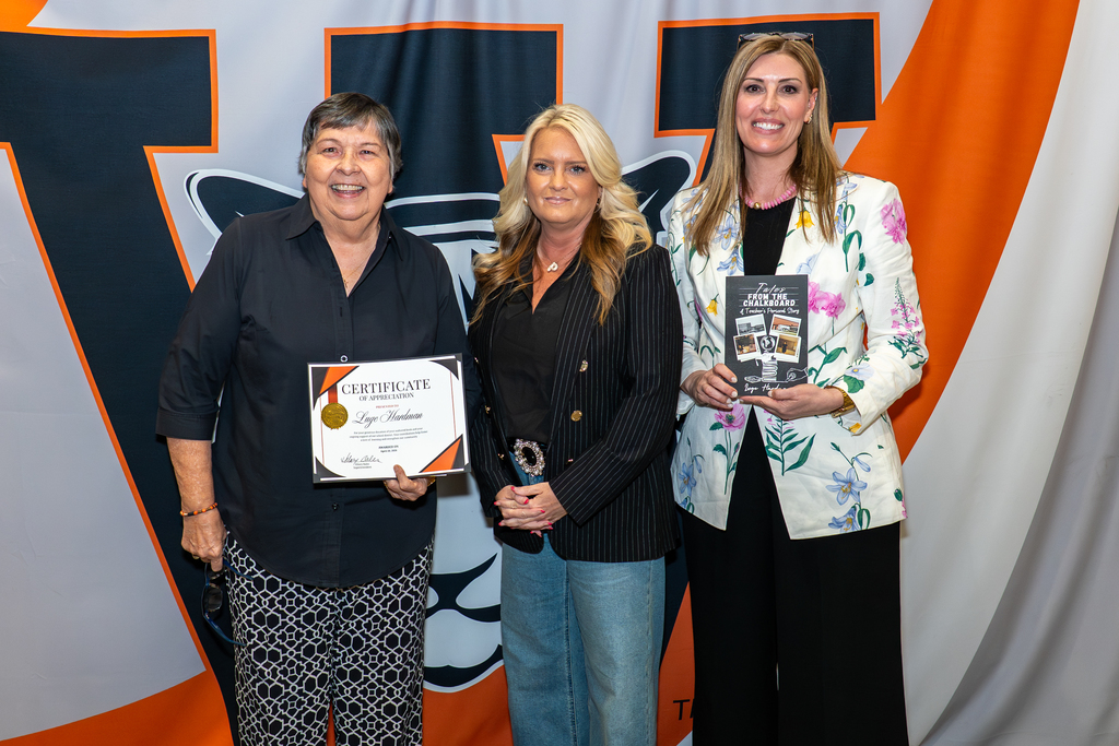 Hardman donates book to district