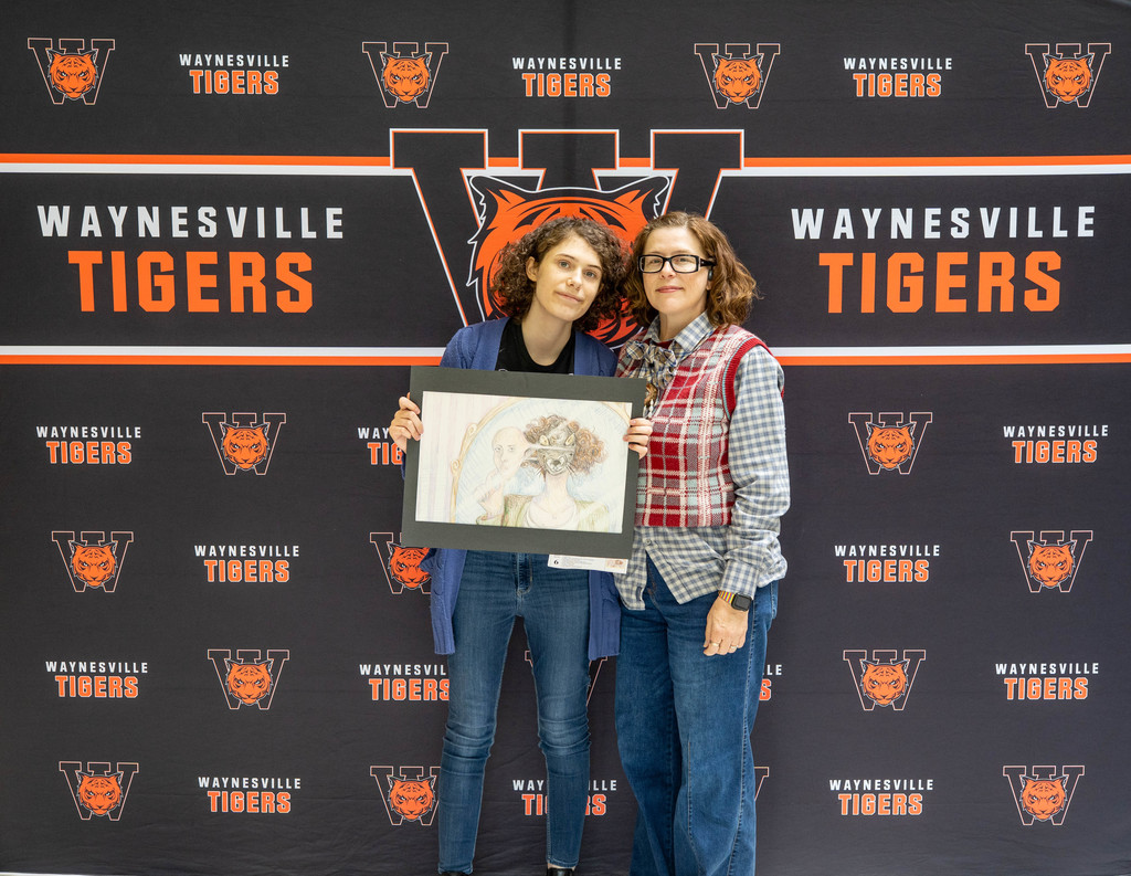 Myla Hendricks, a junior at Waynesville High School, earned a top award for her artwork at the state Capitol and received a $100 gift certificate in celebration of Youth Art Month in April 2026.   For Youth Art Month from March 9 to April 9, students from across the state are selected to have their artwork displayed in the 3rd-floor Rotunda of the State Capitol in Jefferson City, Mo. Hendricks was one of the four selected from Waynesville High School. At the closing ceremony of the Youth Art Month, 15 students were selected for the top awards. Hendricks received the Fine Arts Coordinator Choice Award for her alternate self-portrait in colored pencil titled "Masking."  She received a $100 gift certificate sponsored by Blick Art Materials. Hendricks’ teacher is Sarah Luttrell. 