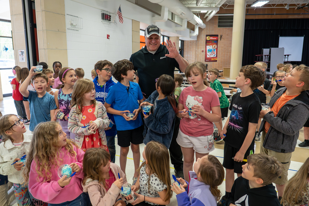In celebration of April being the Month of the Military Child, Culver’s of St. Robert provided custard sundaes to students and staff at Waynesville Schools during the week of April 20-24, including at East Elementary on April 22, 2026.  A special thanks goes to Shaun Morris of Culver’s who donated approximately 7,000 custard sundaes, Ed Morse Ford for providing the vehicles for transporting the custard, Rick Harne for organizing the week, Paula Tackett for organizing the volunteers, Infuze Credit Union, USO, The Pulaski County Sewer District #1, and other volunteers who delivered and served the custard.  At East Elementary, Shaun Morris, owner of Culver’s in St. Robert, Stephanie Linville, FBC for Culver’s in the St. Louis area, and Michael Wieland, director of operations at Culver Franchising System, joined the volunteers to help hand out the custard. They are pictured next to a thank you sign created by East students.