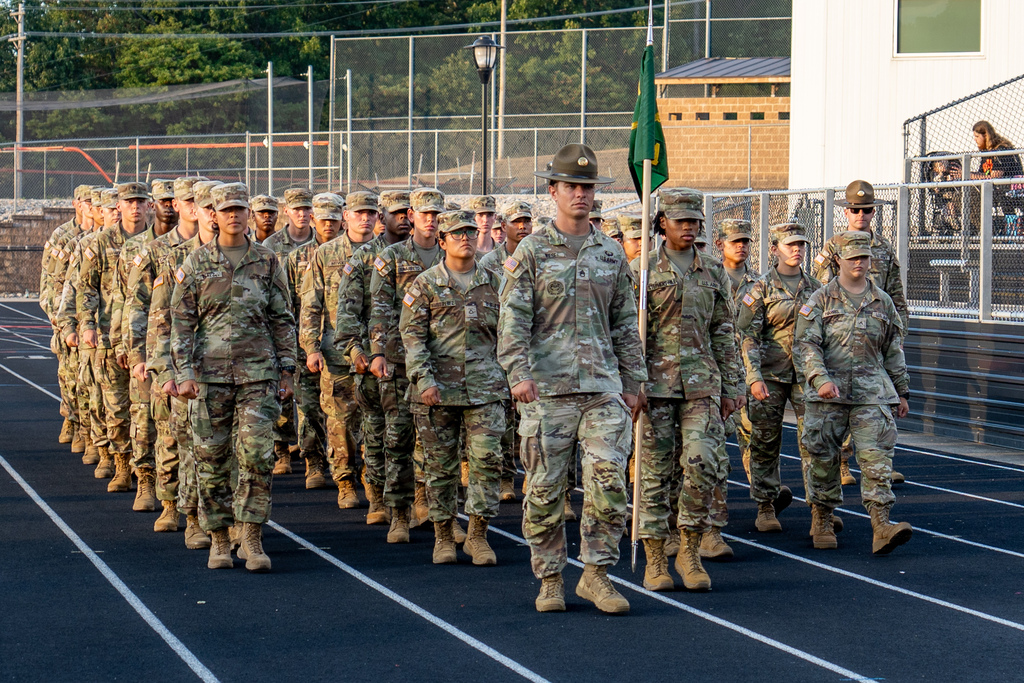 Soldiers from the 14th Military Police Brigade marching on the track in Tiger Stadium
