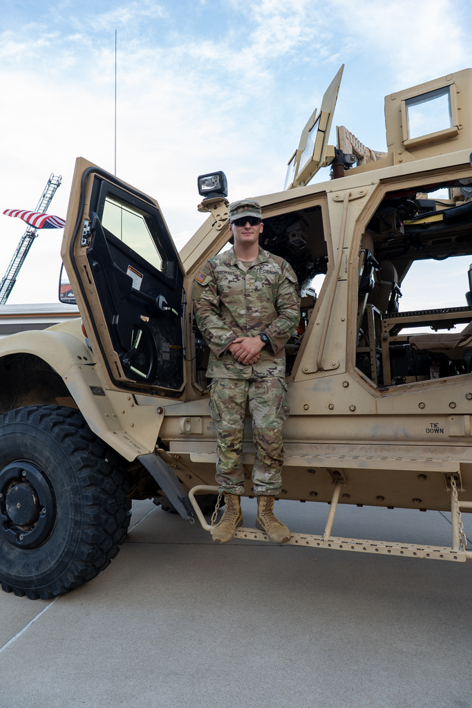 Soldier with military vehicle