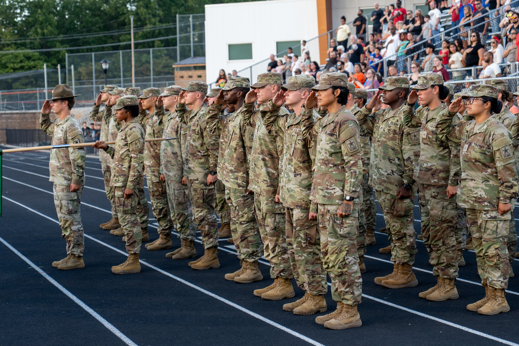 Soldiers from the 14th Military Police Brigade saluting