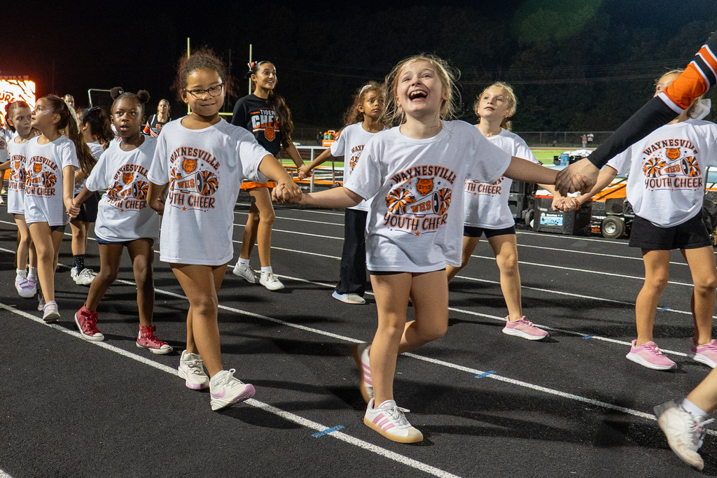 Future cheer participants perform during half time
