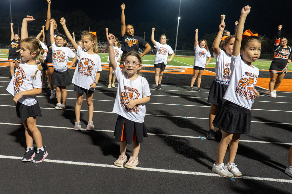 Future cheer participants perform during half time