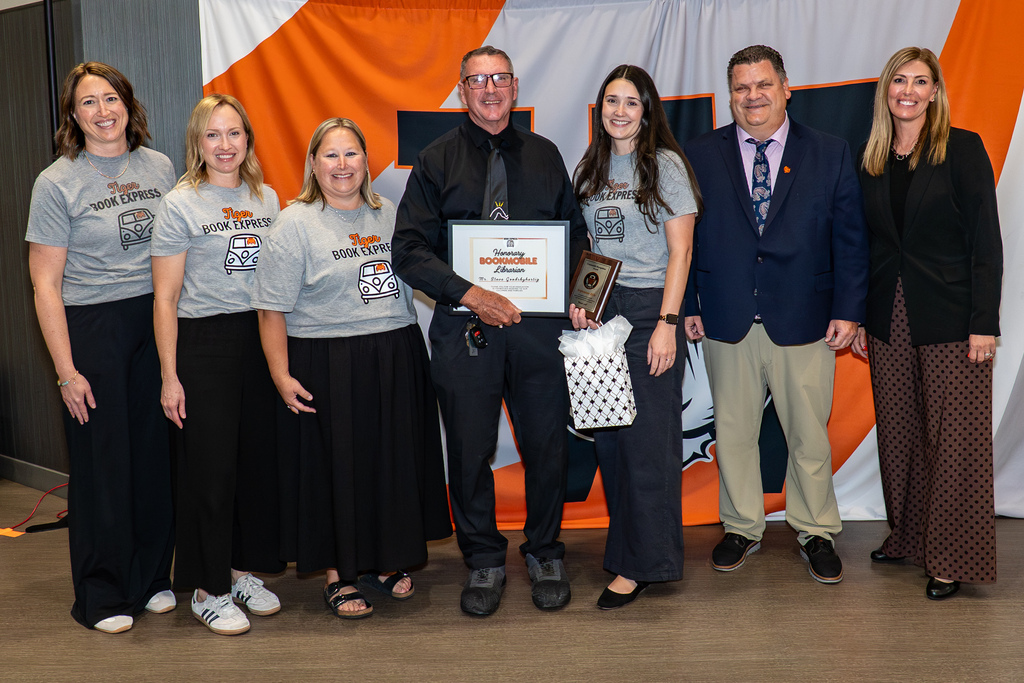 Steve receiving award at board meeting
