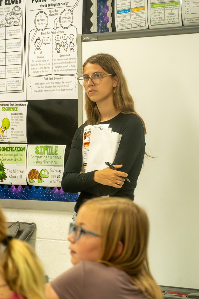 A female high school student observing how to run a classroom.