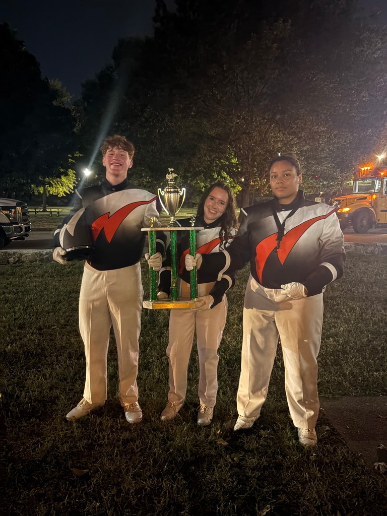 Three drum majors with trophy 