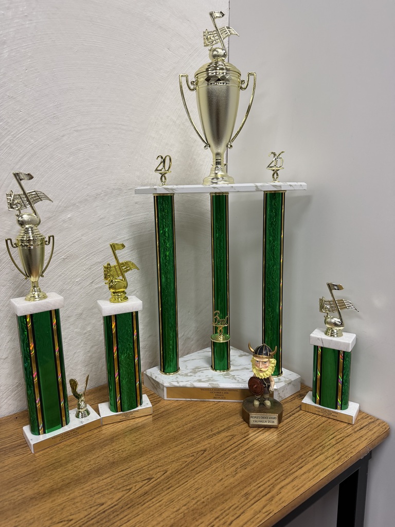 Five trophies on a table 