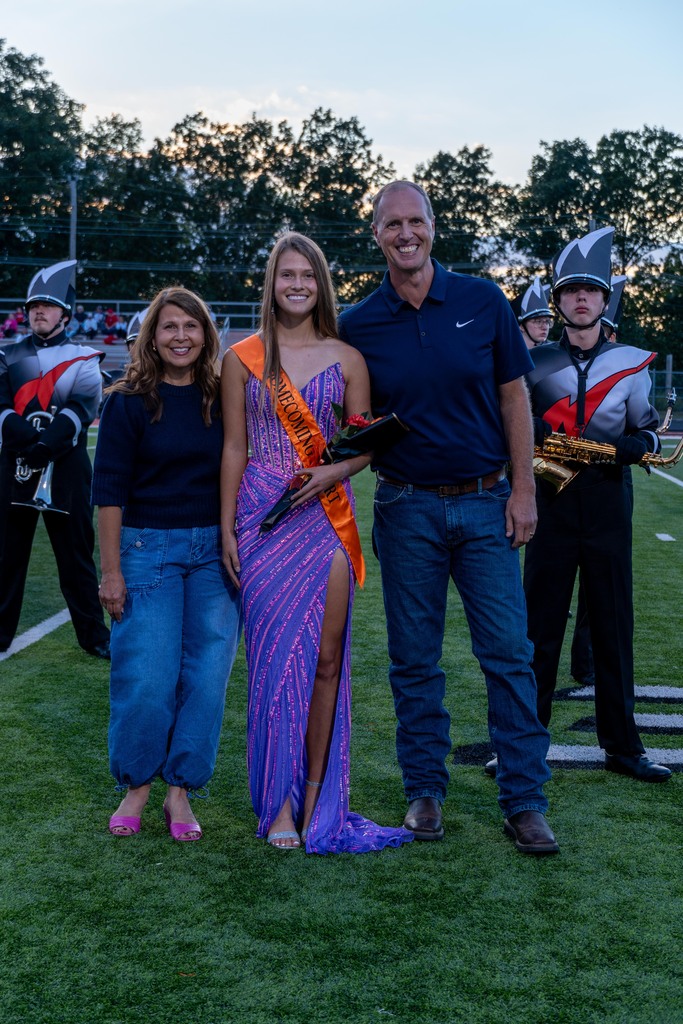 A female High school student with her mom and dad