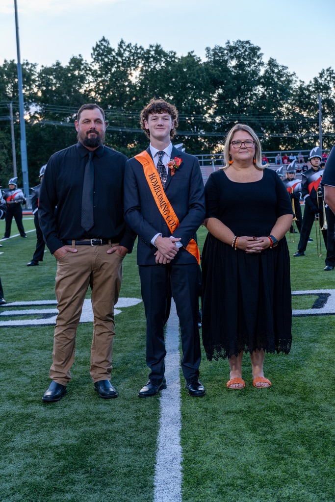 A High School boy and his mom and dad