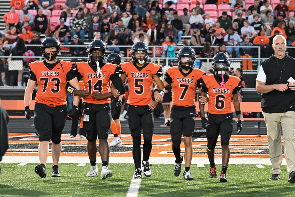 Vasity football captins walking out.