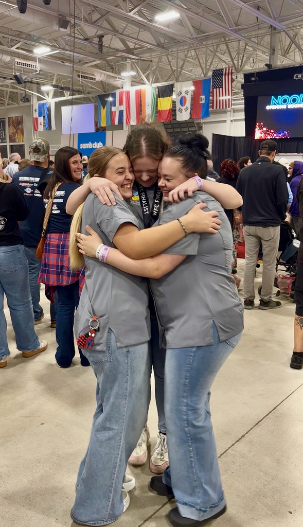 Molly McDermitt, Cycila Keeney, & Samantha Etheridge hugging when they found out they made it to the finals.