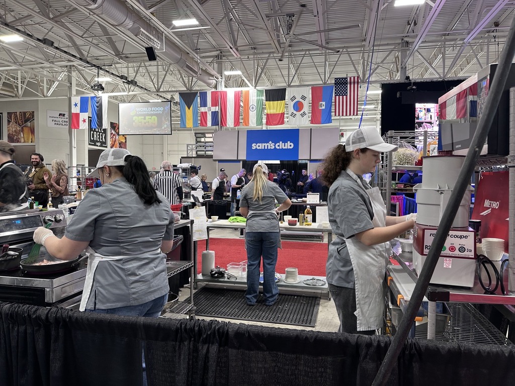 Molly McDermitt, Cycila Keeney and Samantha Etheridge cooking during Finals at the World Food Championships.