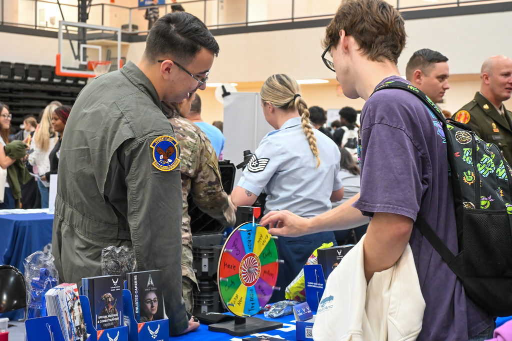 A student talking to a r Air force recruiter