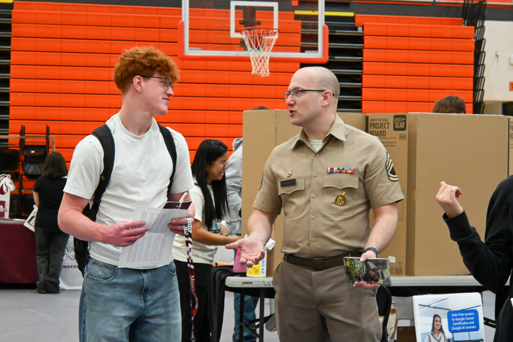 A student talking to a recruiter