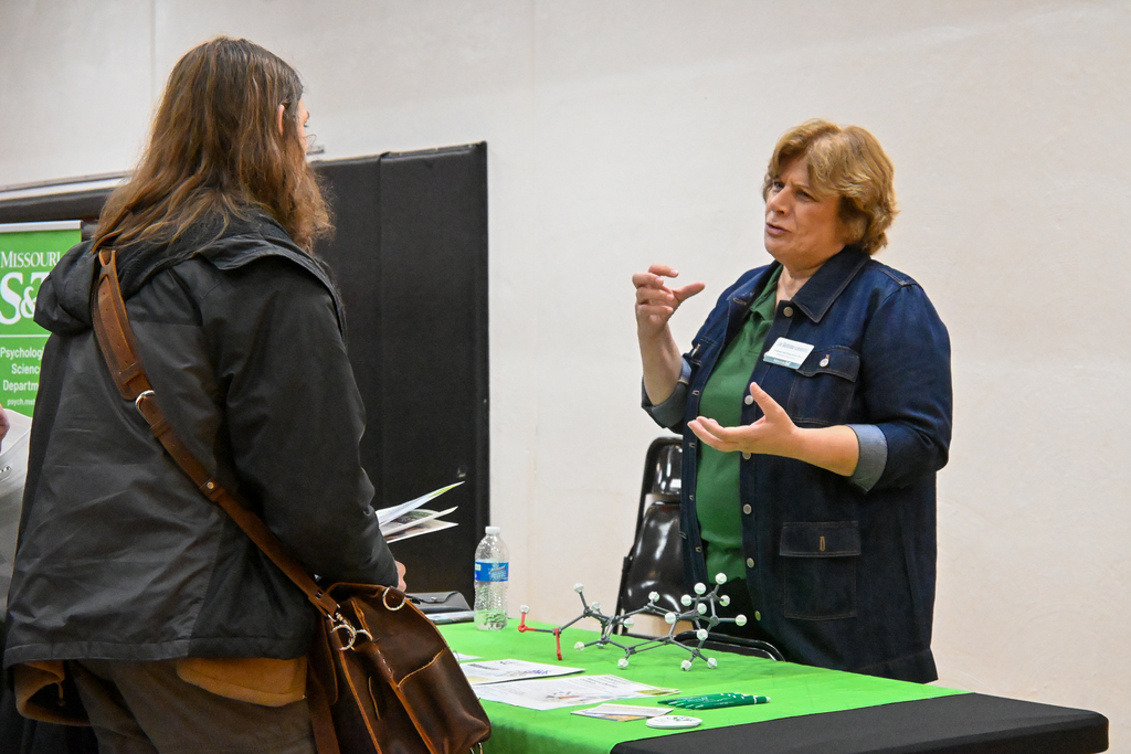 A college advisor talking to a student about their program