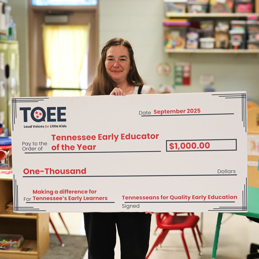 image of brandie roberts holding check