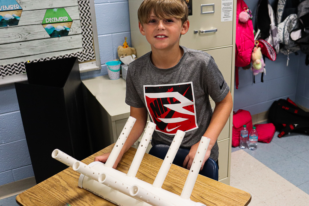 Student with Invention