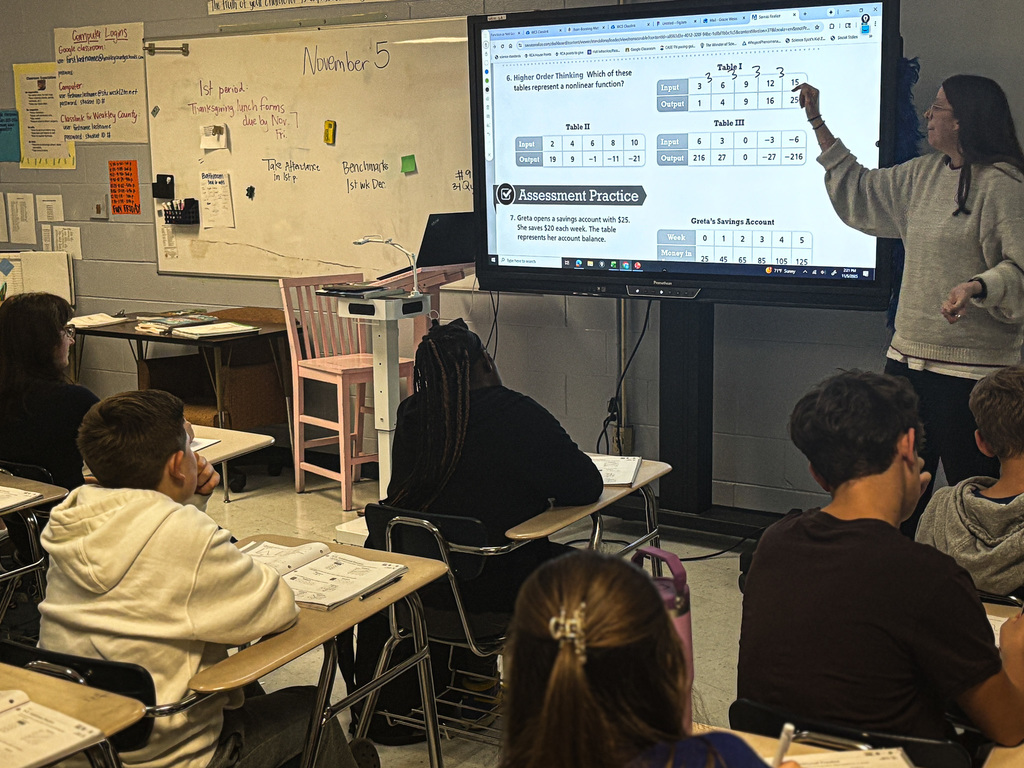 gracie weiss working with students in math class 