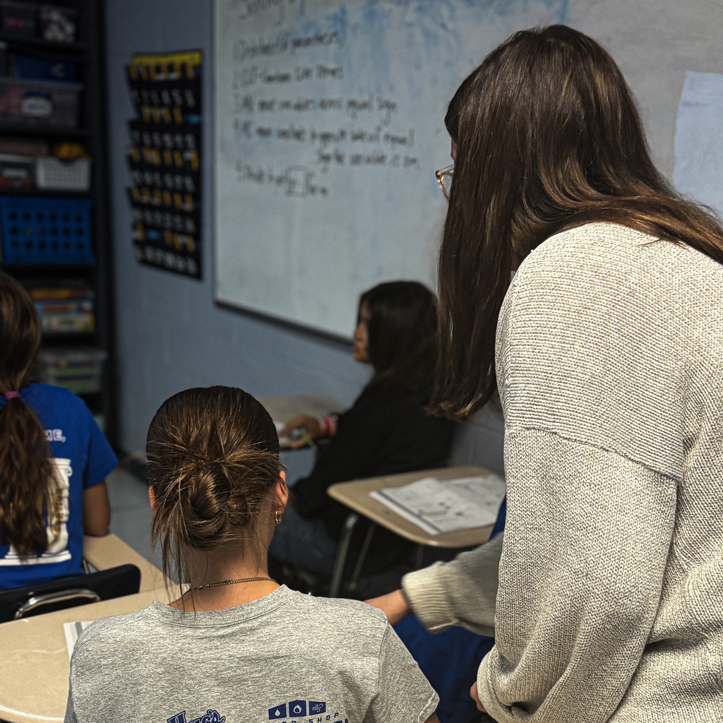 gracie weiss working with students in math class 