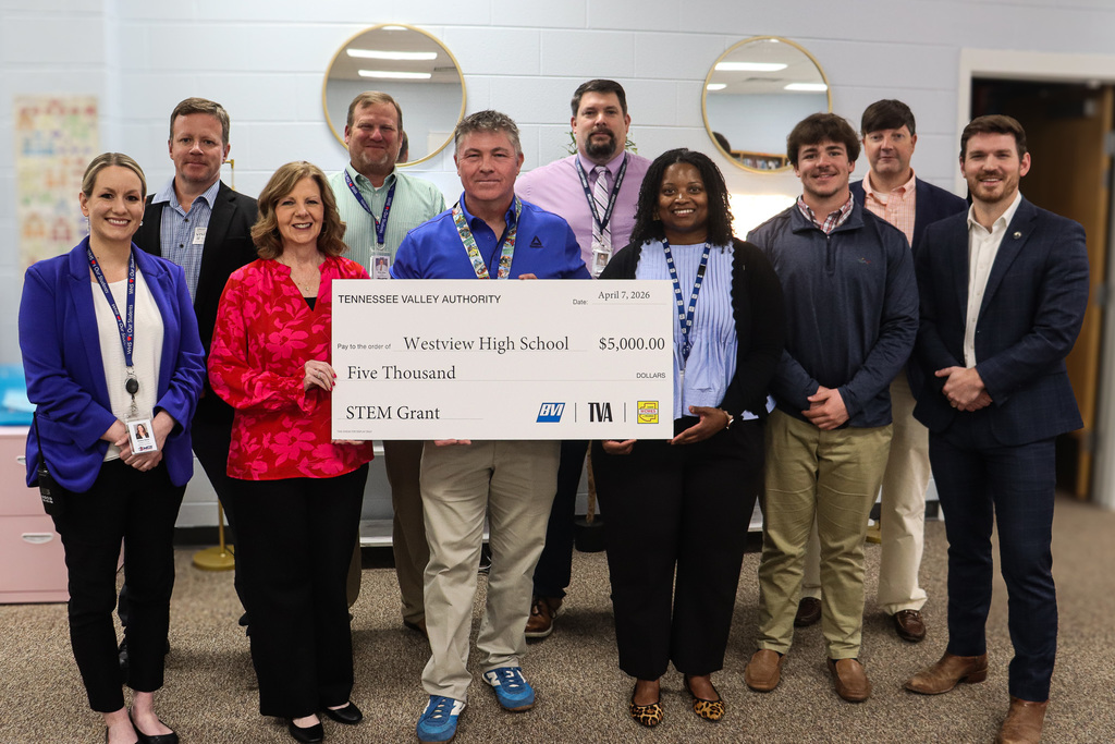 Administrators and community members stand together holding a $5,000 Tennessee Valley Authority STEM grant check for Westview High School.
