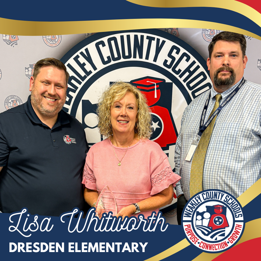 Three people stand in front of a sign. A woman holds an award and smiles. Text reads "Lisa Whitworth Dresden Elementary."