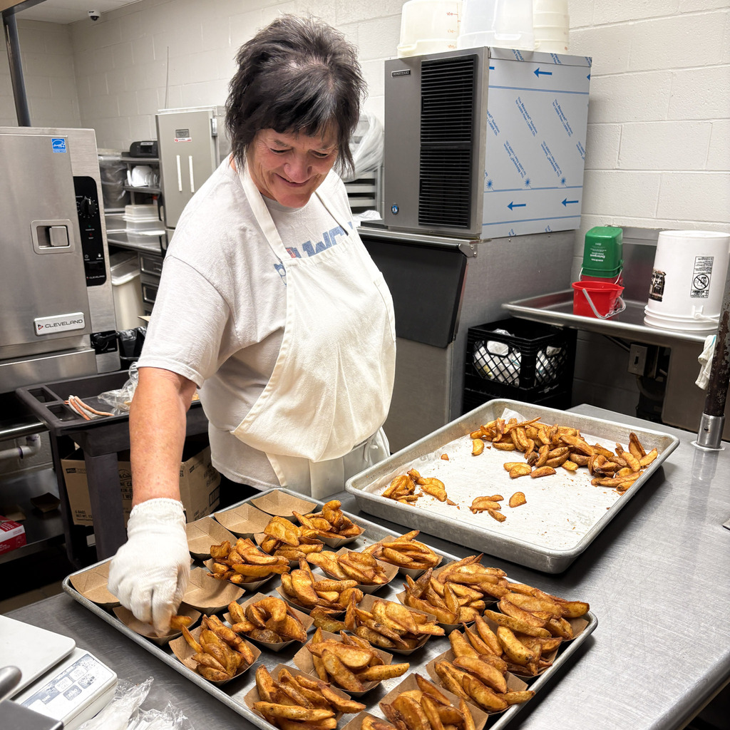 a woman prepares food for lunch