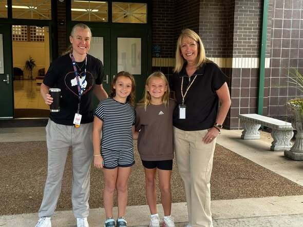 Two students with principal. 