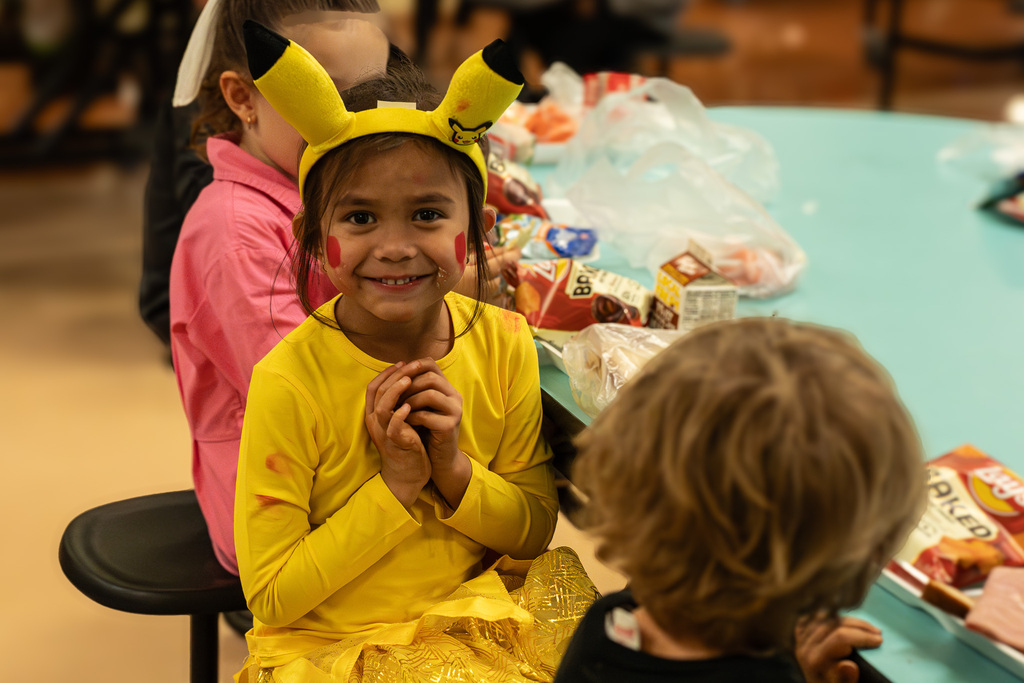 smiling child in a halloween costume