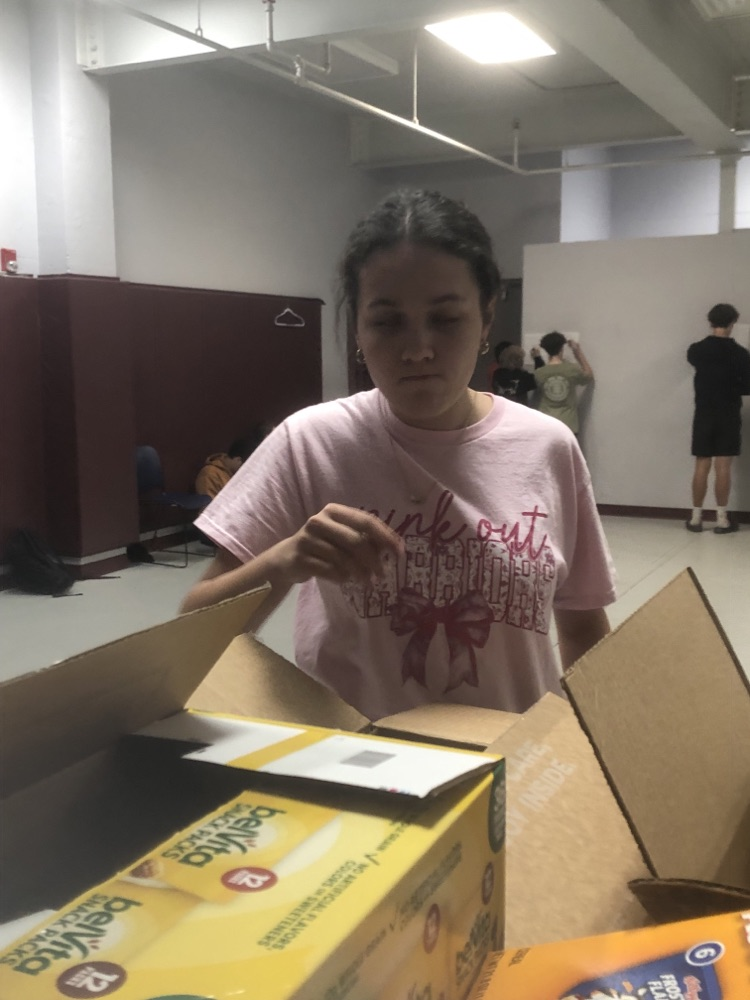 11/12 filling backpacks with food.