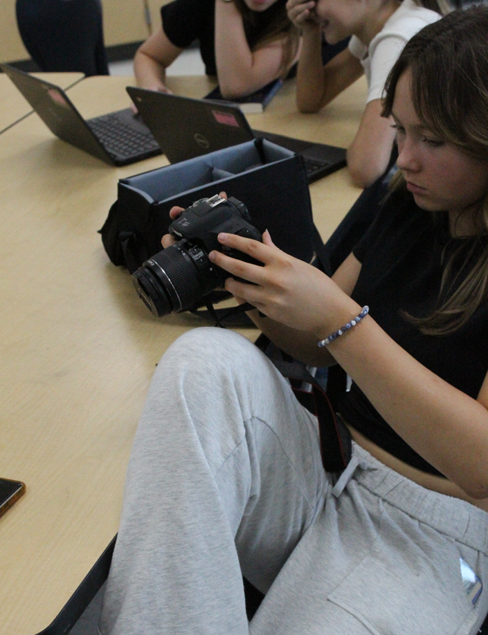 Student working on camera