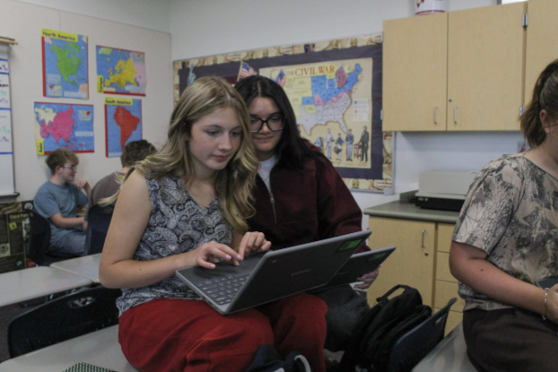 Two Students working together on a chromebook