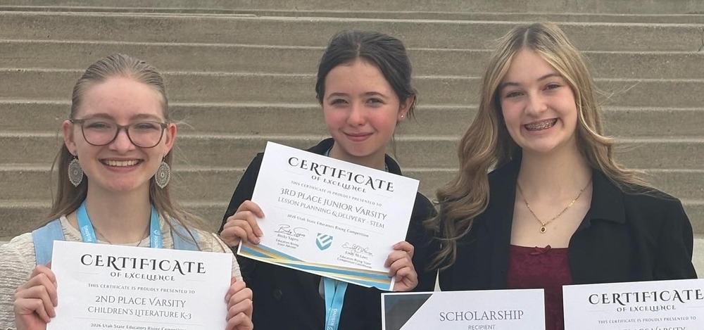 Three Bonneville girls pose with their certificates after an Ed Rising Competition. 