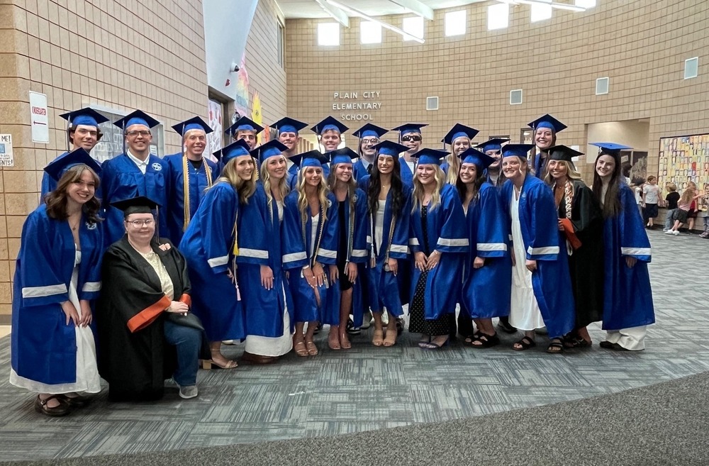 class of 2026 high school graduates smiling together