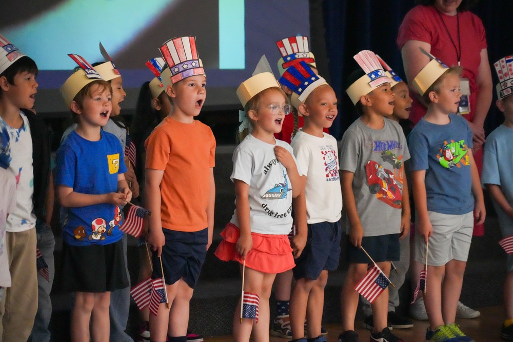 Students singing American songs. 
