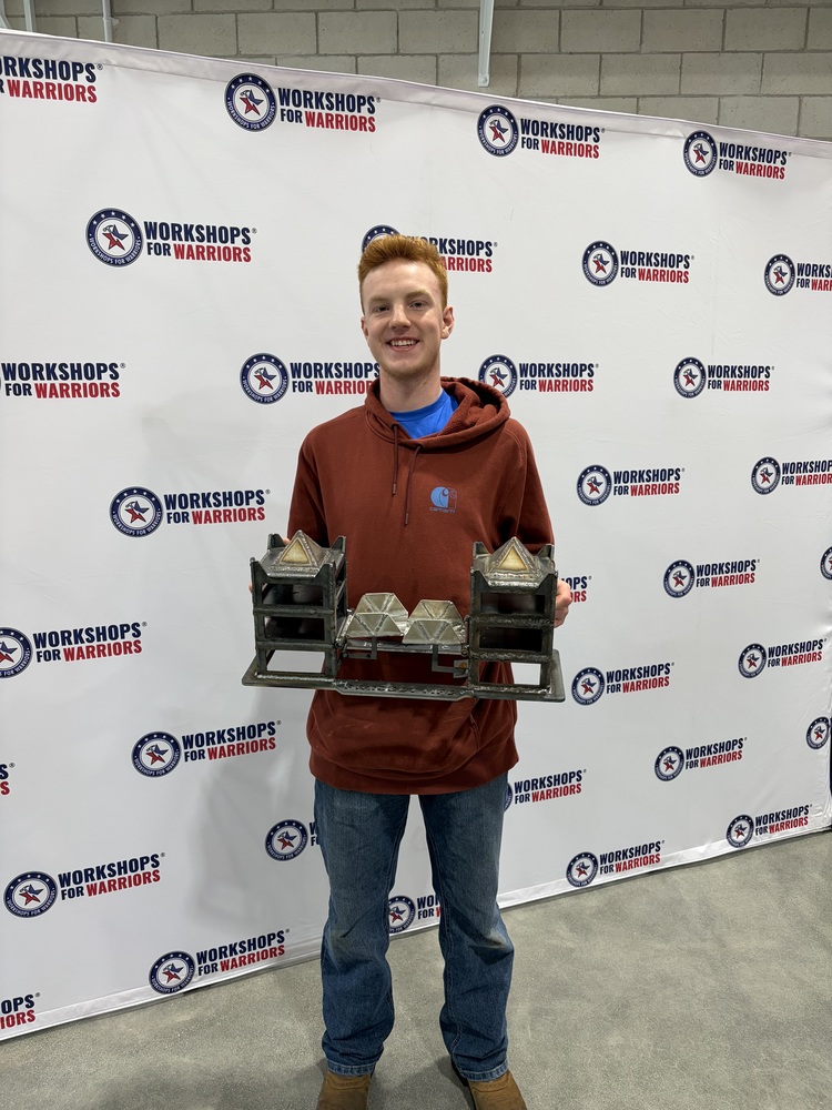 Brenden and his bridge at the National Welding Competition