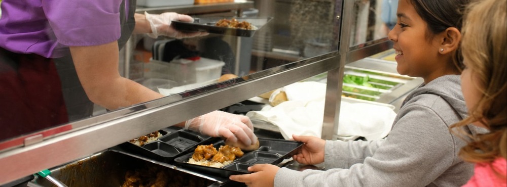 Students getting school lunch.