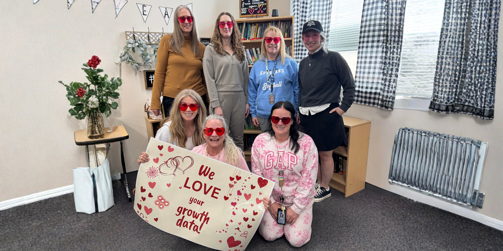 ELA team holding a poster of their  award