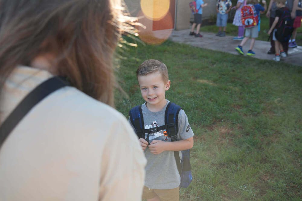 Young boy meeting his teacher