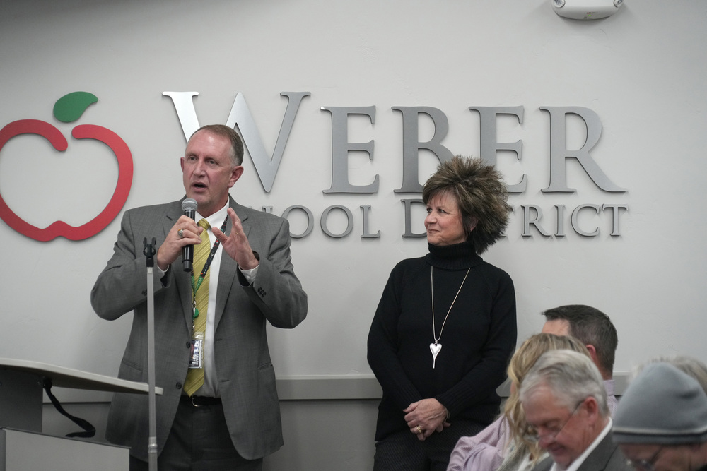 photograph at our board meeting of Matt Williams and Mrs. DiAne Morin receiving an award. 