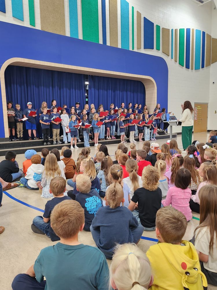 choir performing for students