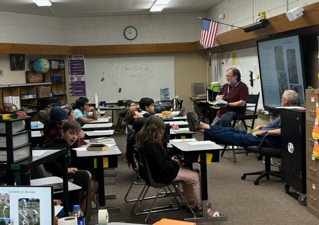 Mr. Willie reading to 6th graders