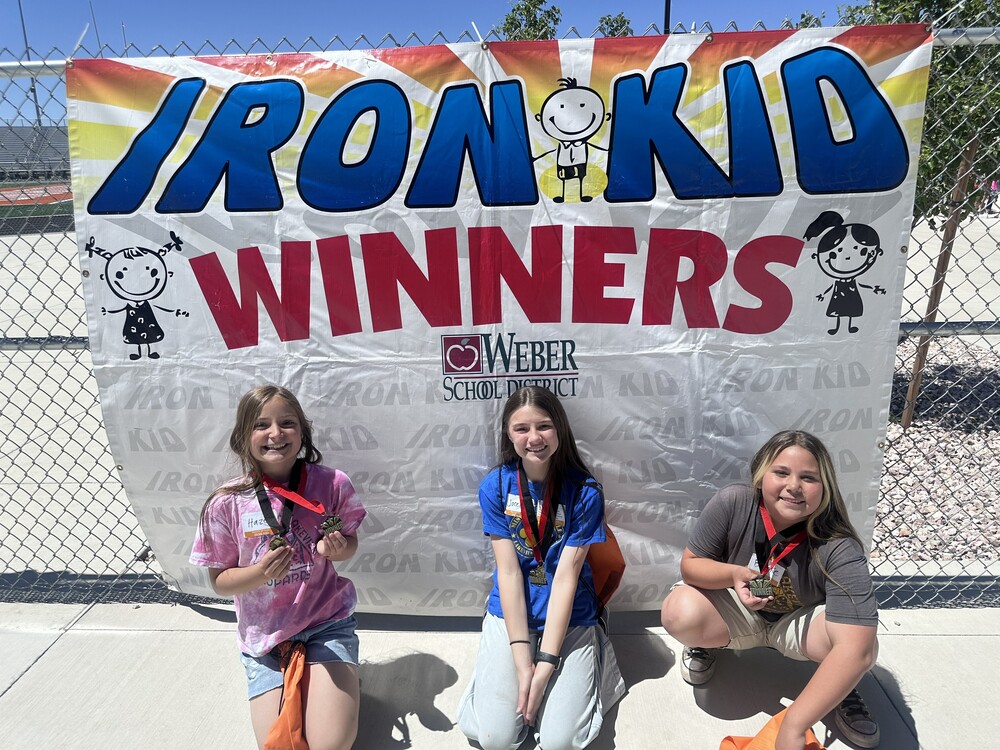 Students from Lakeview Elementary with the Iron Kid Winners banner in the background.