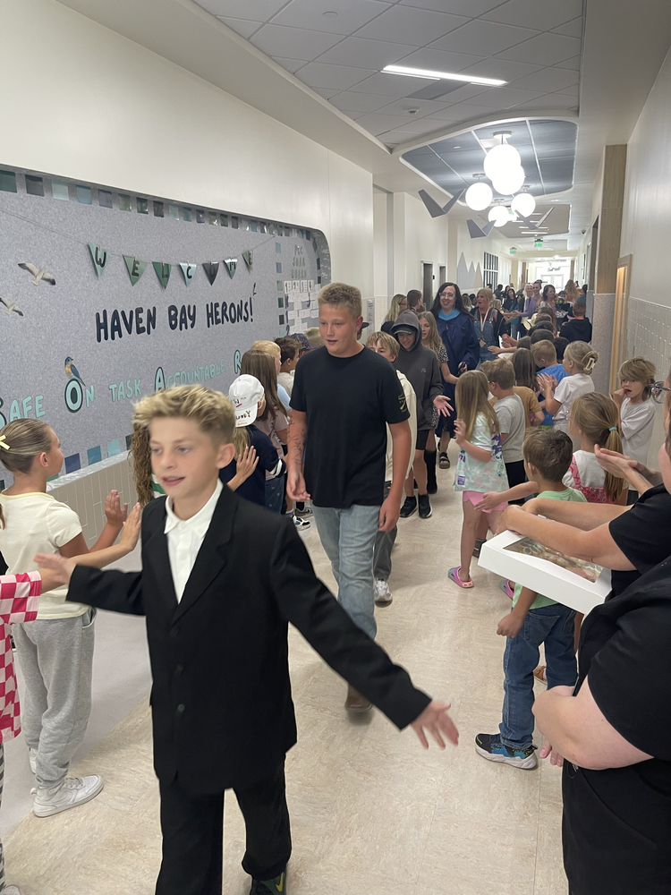 6th Grade students being congratulated