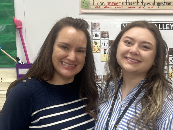 image of 2 teachers standing together smiling
