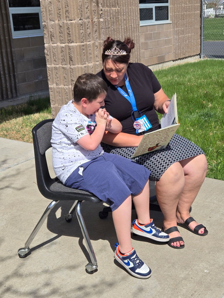 Teacher and Student reading in chairs