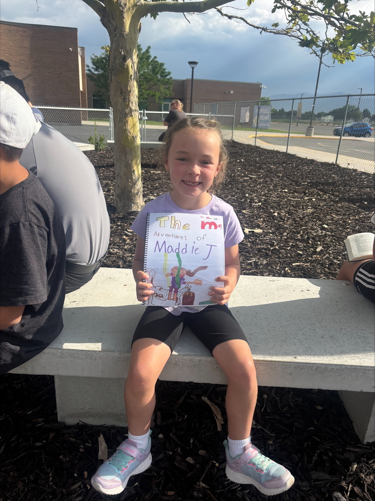 Girl reading on a bench.