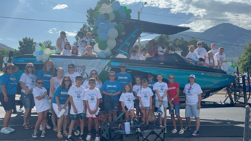 Majestic Teachers and staff in front of and in a boat at the Cherry Days parade